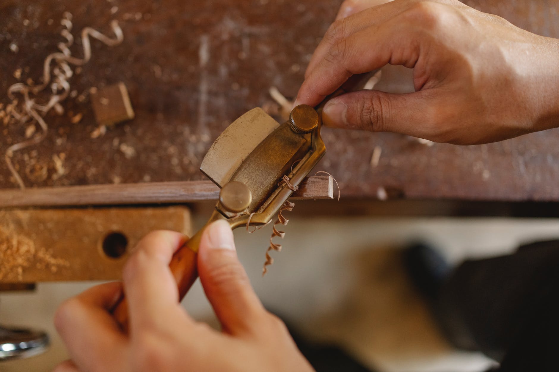 close up photo of craftsman crafting wood